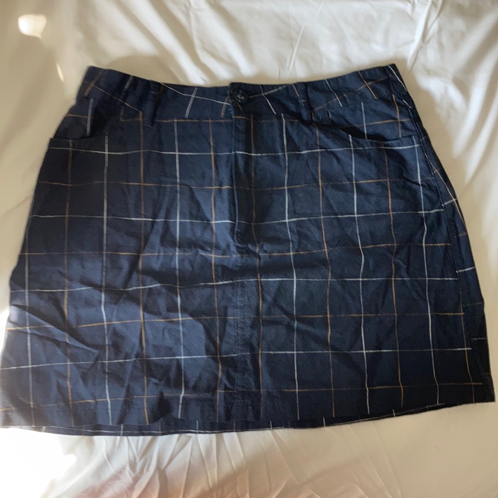 Navy plaid skirt with yellow and white details